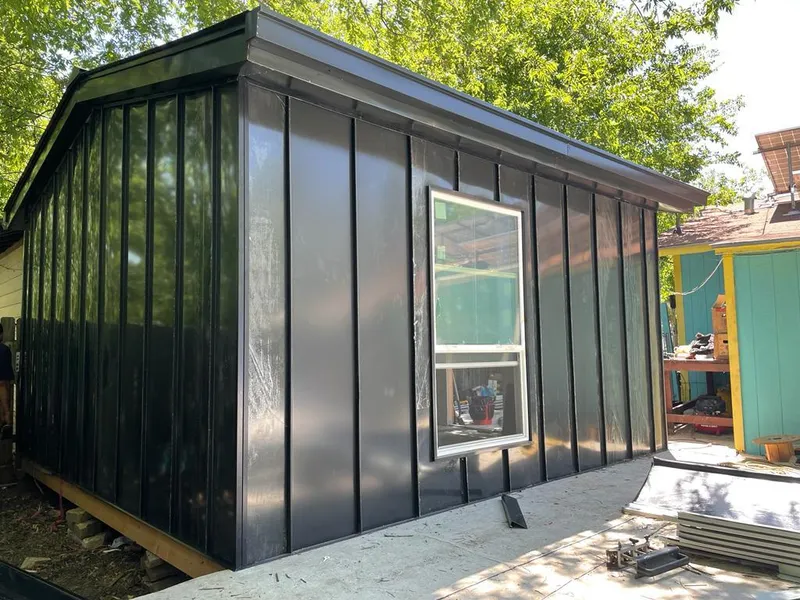 Black standing seam metal wall panels for Metal Roof Installation in Golden