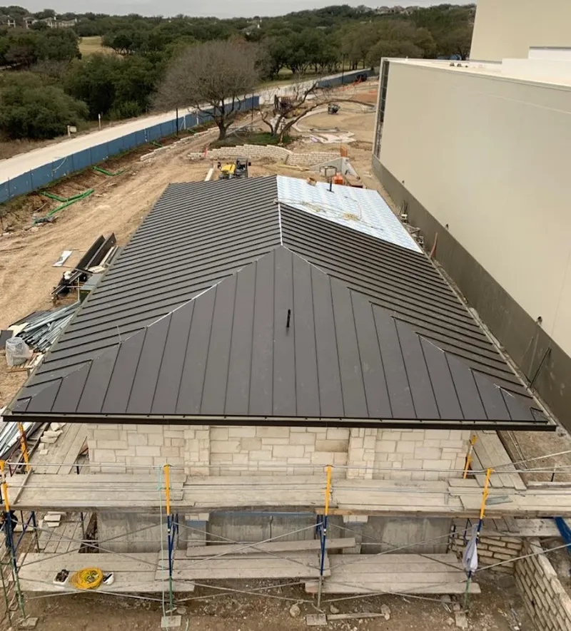 Metal roof new construction with scaffolding in Golden